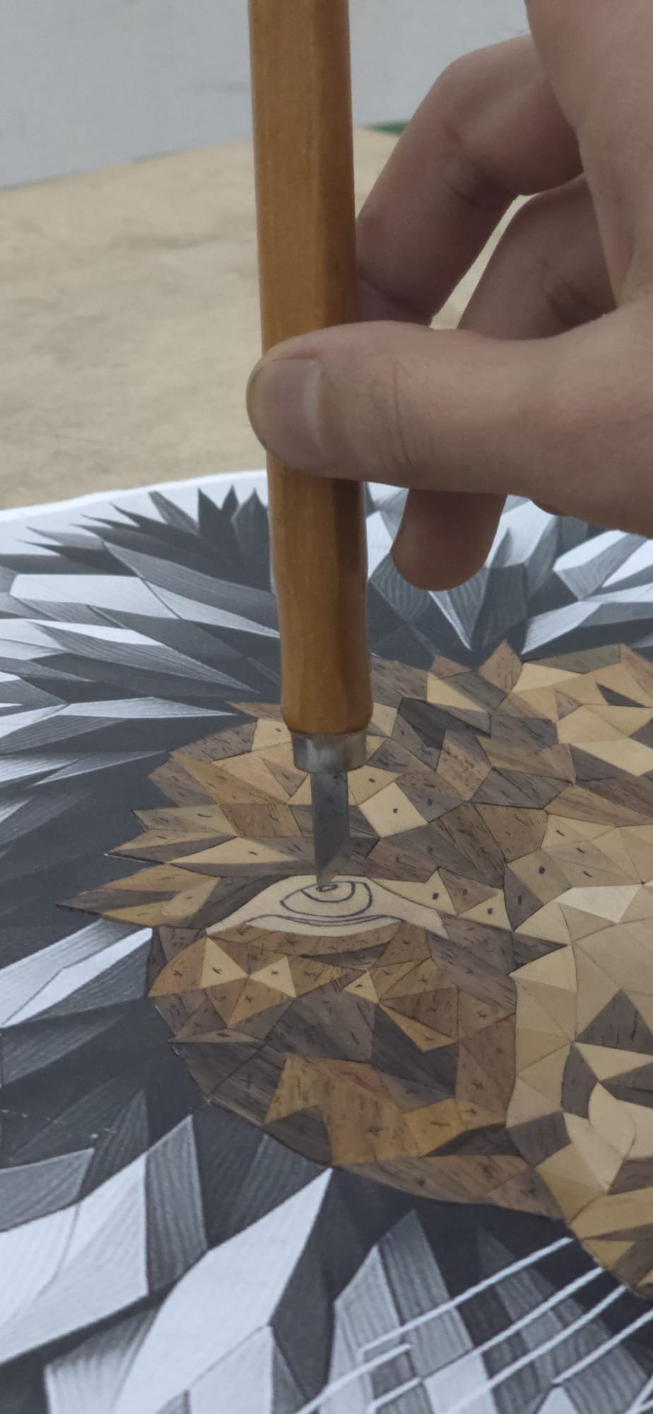 Marquetry construction in progress on the studio workbench