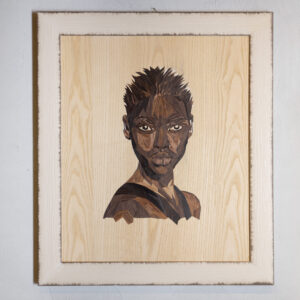 Handmade marquetry portrait titled “Black Woman,” composed of 782 natural wood pieces forming the elegant face of a Black woman, symbolizing strength, heritage, and beauty.