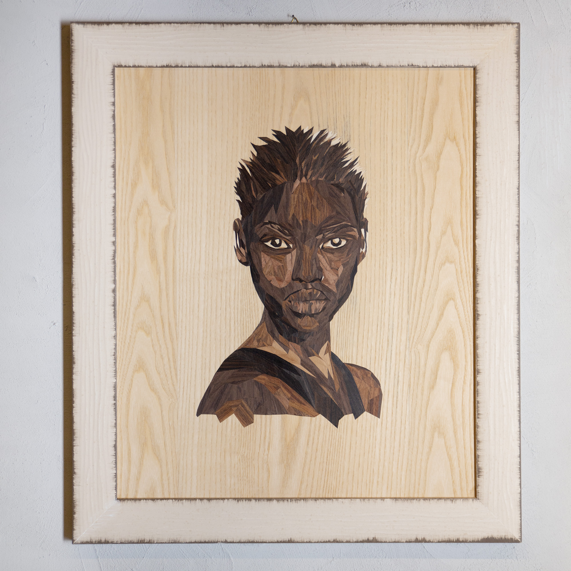Handmade marquetry portrait titled “Black Woman,” composed of 782 natural wood pieces forming the elegant face of a Black woman, symbolizing strength, heritage, and beauty.